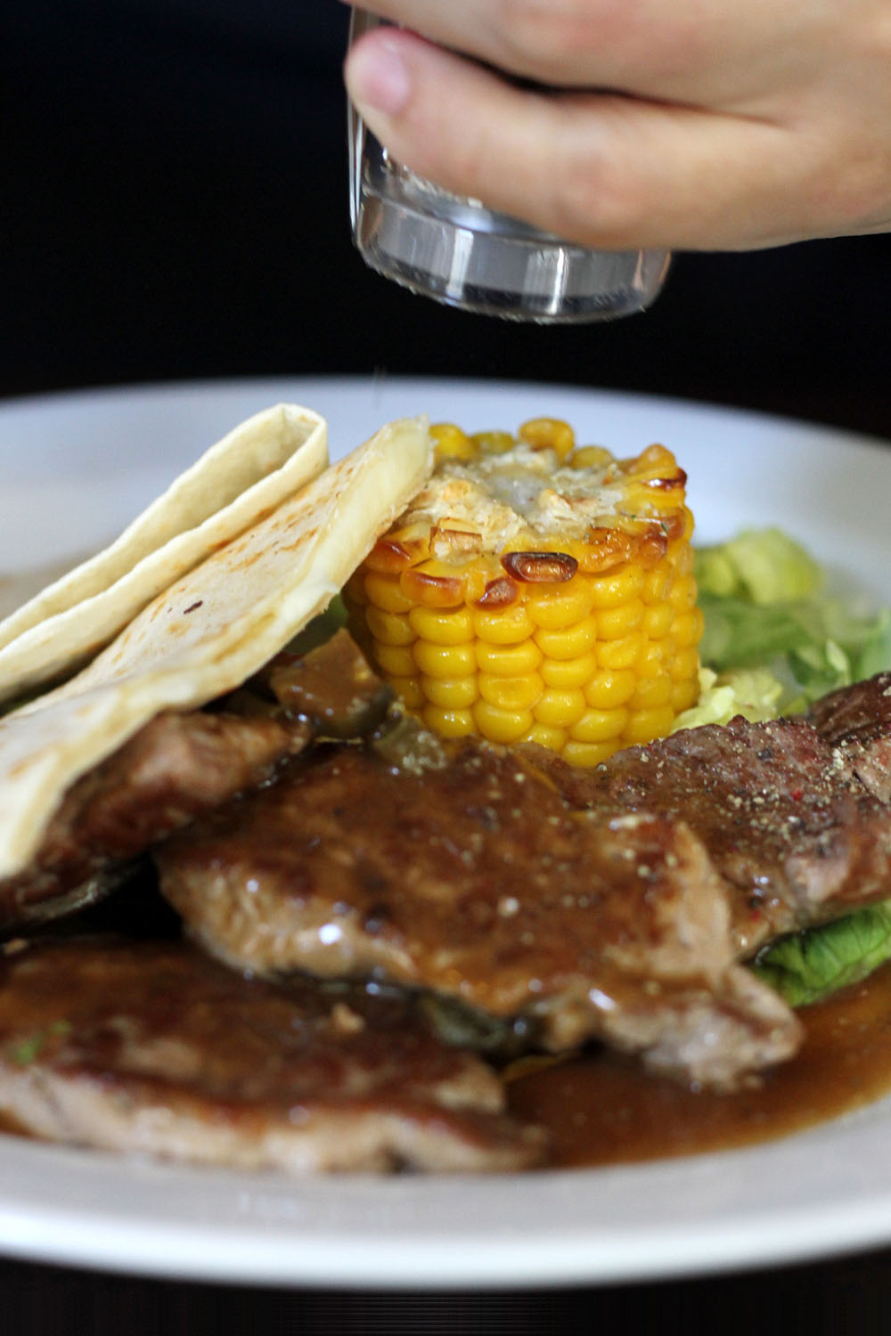 Medallions of pork with jalapenos, grilled corn and cheese quesadillas